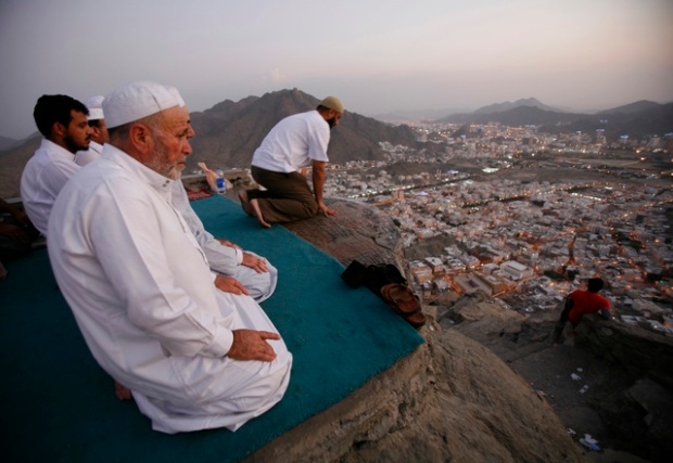 Muslim Pilgrims pray at the top of Mount Noor in Mecca, during the annual Haj Pilgrimage